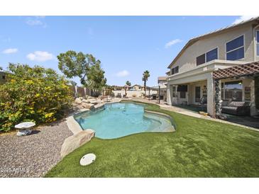 A pristine pool and outdoor living space provide the perfect backdrop for relaxation and outdoor entertaining at 13160 W Windsor Ave, Goodyear, AZ 85395