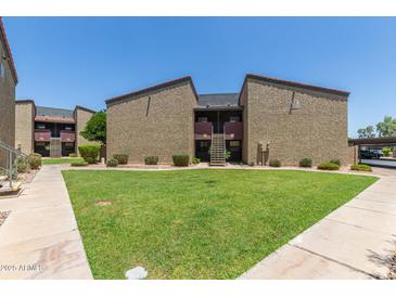 Inviting apartment complex showcasing well-maintained lawns and convenient access to units at 1730 W Emelita Ave # 2033, Mesa, AZ 85202