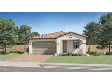 Charming single-story home with a tile roof, desert landscaping, and a two-car garage at 3122 S 156Th Ave, Goodyear, AZ 85338