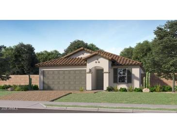 Beautiful single-story home with a two-car garage and a well-manicured lawn at 9830 W Pinchot Ave, Phoenix, AZ 85037
