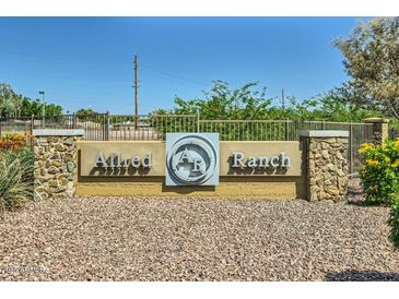 Allred Ranch community entrance sign with stone accents and desert landscaping at 2955 E Flossmoor Ave, Mesa, AZ 85204