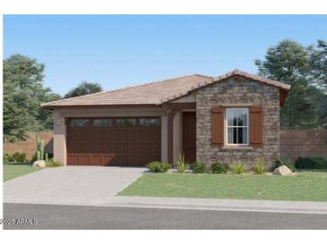 Charming single-story home featuring a stone facade, two-car garage, and well-maintained landscaping at 4787 E French Rd, San Tan Valley, AZ 85143