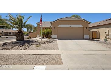 Charming single-story home with a two-car garage and landscaped front yard at 2861 E Morenci Rd, San Tan Valley, AZ 85143