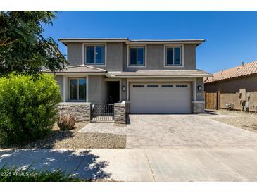 Beautiful two-story home with a well-manicured front yard and a two-car garage at 20926 E Longwood Dr, Queen Creek, AZ 85142