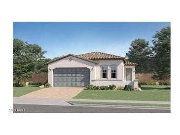 Charming single-story home featuring a tile roof, two-car garage, and manicured landscaping at 23345 W Mobile Ln, Buckeye, AZ 85326