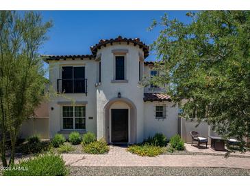 Charming two-story home featuring unique turret architecture, mature landscaping, and a welcoming front entrance at 29431 N 122Nd Gln, Peoria, AZ 85383