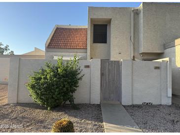 Desert home with stucco exterior and a charming gated courtyard at 1342 W Emerald Ave # 373, Mesa, AZ 85202