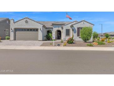 Attractive single-story home featuring a front yard with desert landscaping at 27667 W Mohawk Ln, Buckeye, AZ 85396