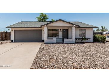 Charming single-story home features a well-maintained front yard, gray garage door, and inviting entrance at 343 W Santa Cruz Dr, Tempe, AZ 85282