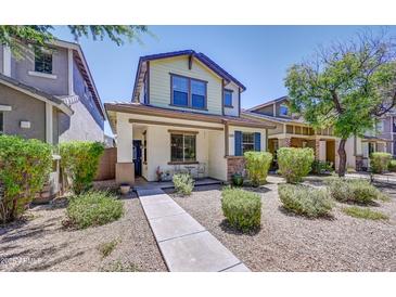 Charming two-story home featuring a landscaped yard with desert landscaping for easy maintenance and appealing curb appeal at 4379 E Rosemonte Dr, Phoenix, AZ 85050