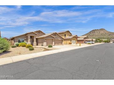 Charming single Gathering homes featuring desert landscaping and convenient two-car garages at 6602 W Lariat Ln, Phoenix, AZ 85083