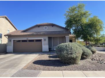 Charming single-story home featuring a well-maintained front yard and a two-car garage at 178 W Pacific Dr, Casa Grande, AZ 85122