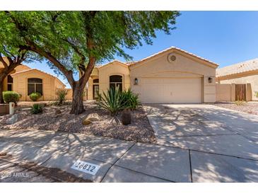 Charming single-story home with desert landscaping and a two-car garage at 18812 N 90Th Pl, Scottsdale, AZ 85255