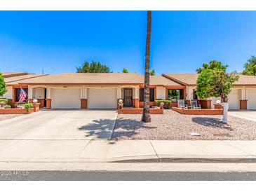 Charming single-story home featuring a two-car garage, easy-care landscaping, and brick accents at 2105 S Zinnia Ave # 468, Mesa, AZ 85209