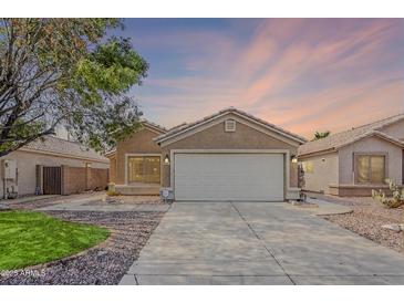 Charming single-story home with a well-maintained front yard and a two-car garage at 3351 W Via Del Sol Dr, Phoenix, AZ 85027