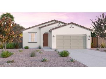 Charming single-story home with a well-manicured front yard, neutral color palette, and an attached two-car garage at 12550 W Luxton Ln, Avondale, AZ 85323