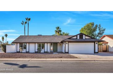 Charming single-story home featuring a low-maintenance desert landscape and an attached two-car garage at 1720 W Highland St, Chandler, AZ 85224