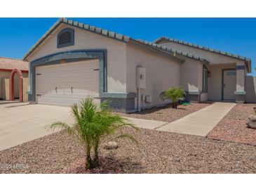 Charming single-story home with well-maintained landscaping and an attached two-car garage at 3014 W Zachary Dr, Phoenix, AZ 85027
