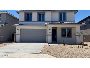 Charming two-story home with a neutral color scheme, attached garage, and simple landscaping at 31762 N Bandit Rd, San Tan Valley, AZ 85143