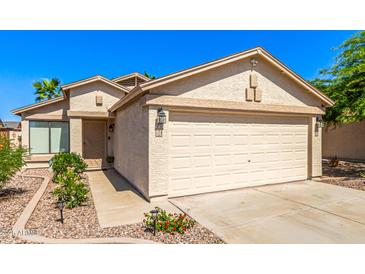 Charming single-Gathering home with a neutral color palette, attached two-car garage, and well-maintained landscaping at 4731 N 86Th Dr, Phoenix, AZ 85037