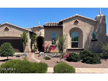 Charming single-story home with desert landscaping, stone accents, and tiled roof at 20502 W Ridge Rd, Buckeye, AZ 85396