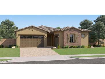 Charming single-story home features a two-car garage and a mix of stucco and stone accents at 23256 W Tamarisk Ave, Buckeye, AZ 85326