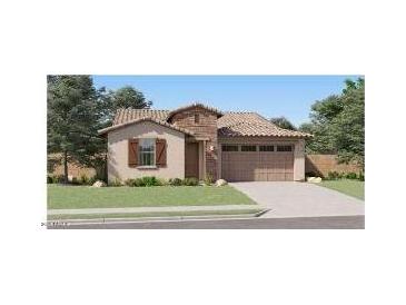 Charming single-story home featuring a neutral color palette, attached two-car garage, and a well-maintained lawn at 3283 E Ranchhand Dr, San Tan Valley, AZ 85140