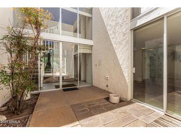 This beautiful patio leads to an interior courtyard, providing an ideal outdoor living space at 4648 N 40Th St, Phoenix, AZ 85018