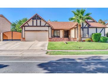 Charming single-Gathering home with a well-manicured lawn, brick accents, and a two-car garage at 6708 W Utopia Rd, Glendale, AZ 85308