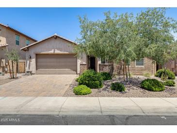Charming single-story home with a well-manicured front yard and a two-car garage, great curb appeal at 699 S 197Th Dr, Buckeye, AZ 85326