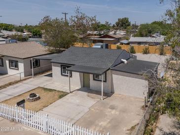 An aerial view of this charming single Gathering house with a small front yard at 826 S Drew St, Mesa, AZ 85210