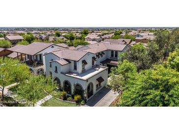 Beautiful, two-story home showcasing its tile roof and landscaped surroundings in a desirable neighborhood at 20437 W White Rock Rd, Buckeye, AZ 85396