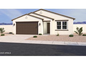 Charming single-story home featuring a two-car garage and desert landscaping at 16190 W Bajada Rd, Surprise, AZ 85387