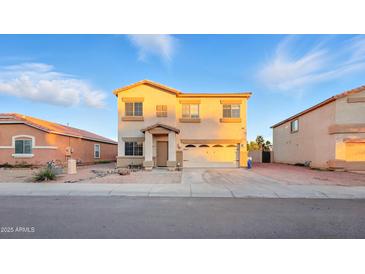 Charming two-story home with a two-car garage and desert landscaping at 6537 W Pioneer St, Phoenix, AZ 85043