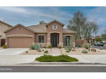 Charming single-story home featuring desert landscaping, a tile roof, and inviting curb appeal at 2221 W Calle De Las Estrella Way, Phoenix, AZ 85085