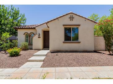Charming single-story home with a tile roof, neutral stucco, and low-maintenance landscaping at 14759 W Alexandria Way, Surprise, AZ 85379