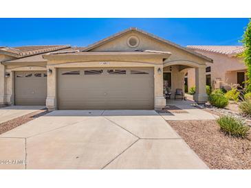 Charming single-story home featuring a two-car garage, landscaped yard, and covered entryway at 16821 S 23Rd St, Phoenix, AZ 85048