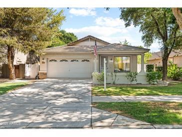 Charming single-Gathering home featuring a well-maintained front yard and an attached two-car garage at 3534 E Linda Ln, Gilbert, AZ 85234