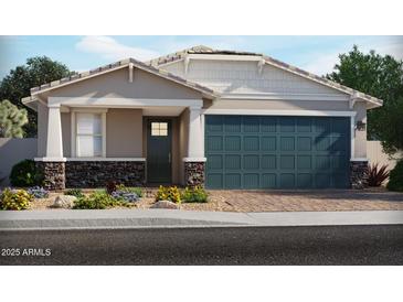 Charming single-story home featuring stone accents, a blue garage door, and a well-maintained front yard at 17595 W Monroe St, Goodyear, AZ 85338