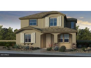 Charming two-story home featuring classic architectural design with neutral colors and symmetrical windows at 9954 W Piccadilly Rd, Avondale, AZ 85392
