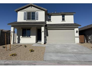 Charming two-story home featuring a two-car garage and neutral color palette at 3125 S 232Nd Ave, Buckeye, AZ 85326