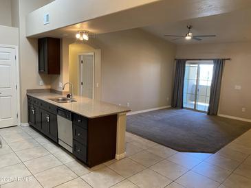 Bright kitchen with granite countertops and stainless steel appliances, open to the living space at 10136 E Southern Ave # 3109, Mesa, AZ 85209