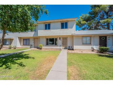 Charming two-story townhouse with well-maintained lawn and inviting curb appeal in a sunny location at 1061 E Fremont Dr, Tempe, AZ 85282