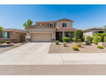 Charming two-story home with a well-manicured lawn and a two-car garage on a sunny day at 12236 W Country Club Ct, Sun City, AZ 85373