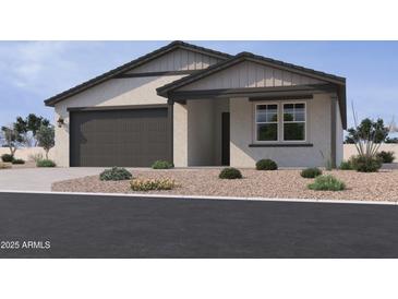 Charming single-story home with neutral stucco, low-maintenance landscaping and a dark gray garage door at 15752 W Camden Ave, Waddell, AZ 85355