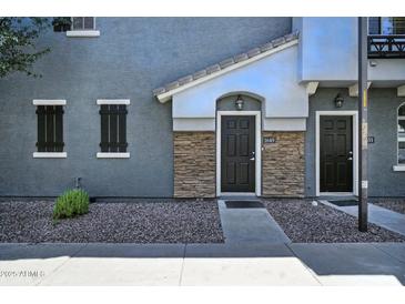 Inviting front entrances with stone accents and well-maintained landscaping at 2402 E 5Th St # 1649, Tempe, AZ 85288