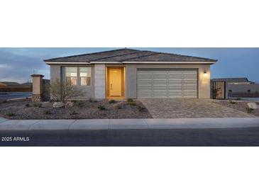 Charming single-story home featuring a well-manicured front yard and a two-car garage at 3310 E Valleyhigh Trl, San Tan Valley, AZ 85143