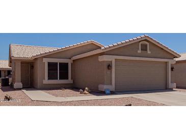 Charming single-story home with well-maintained landscaping and two-car garage at 1341 E Bellerive Dr, Chandler, AZ 85249