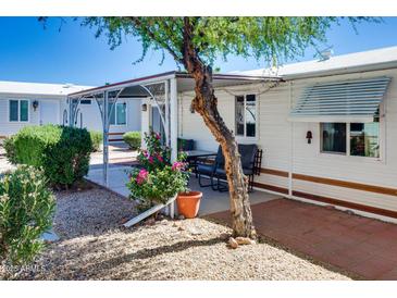 Cozy patio with brick pavers and gravel landscaping, offering a charming outdoor retreat at 17200 W Bell Rd # 2162, Surprise, AZ 85374