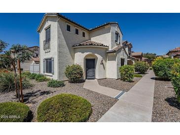 Charming home featuring a stucco exterior, tiled roof, and low-maintenance desert landscaping at 26505 N Babbling Brook Dr, Phoenix, AZ 85083